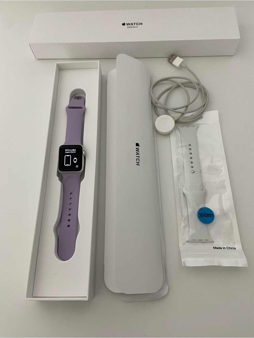 Apple Watch Series 3 with Lavender Sport Band and White Replacement Strap